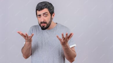 confused young handsome caucasian man showing empty hands isolated white with copy space 141793 77292
