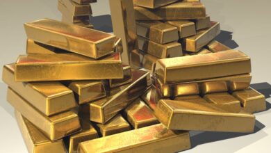 A pile of lustrous gold bars symbolizing wealth and prosperity.