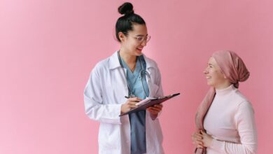 A doctor and cancer patient sharing a positive moment with empathy and care.